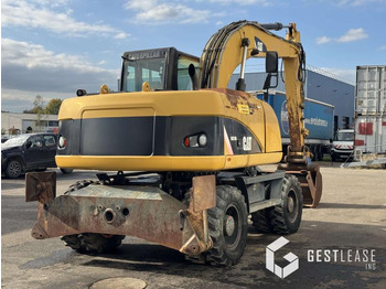 Багер на тркала Caterpillar M313D: слика 3