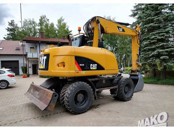 Багер на тркала Caterpillar M313D: слика 4