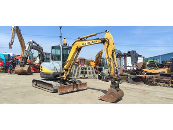 Мини багер NEW HOLLAND