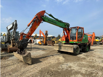 Багер на тркала NEW HOLLAND