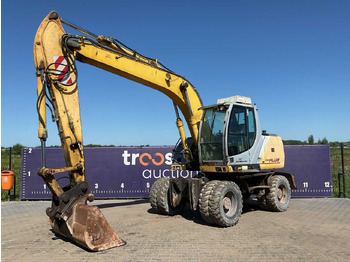 Багер на тркала NEW HOLLAND