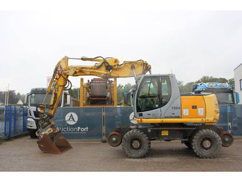 Багер на тркала New Holland MH5 Plus: слика 2 Багер на тркала New Holland MH5 Plus: слика 2