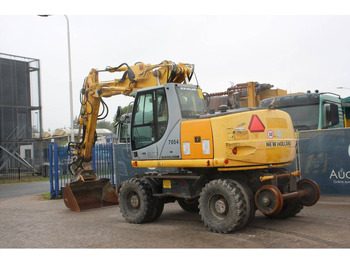 Багер на тркала New Holland MH5 Plus: слика 3 Багер на тркала New Holland MH5 Plus: слика 3