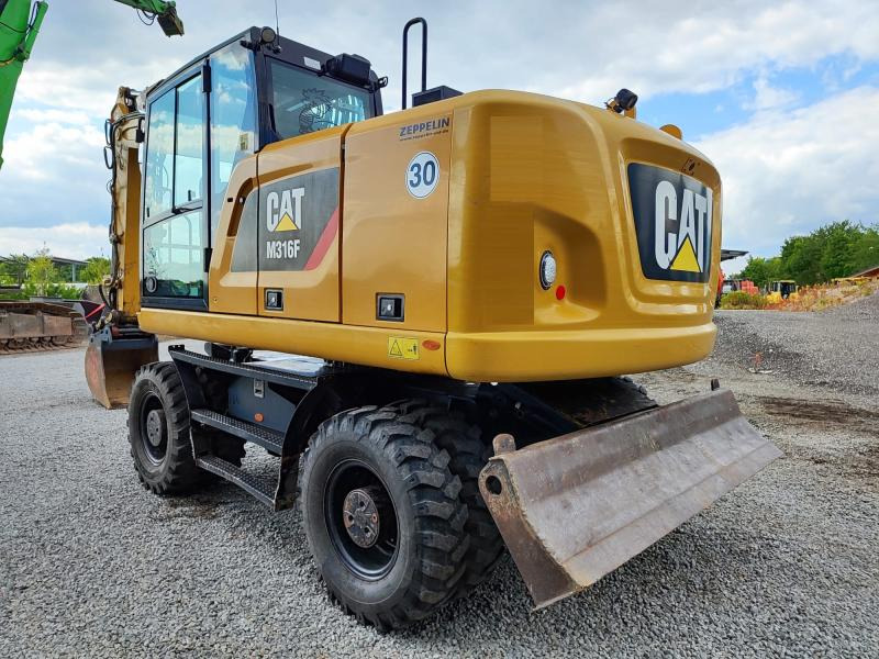 Caterpillar M316F - Багер на тркала: слика 1 Caterpillar M316F - Багер на тркала: слика 1