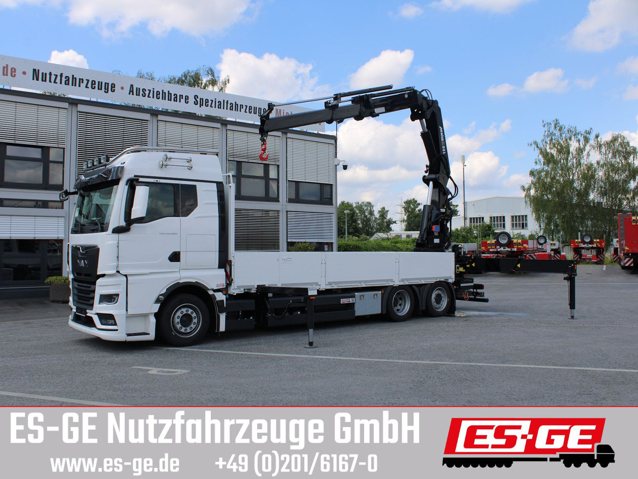 MAN TGX 26.480 6x2-4 LL CH mit MKG HLK531 a5 - Камион со платформа, Камион со кран: слика 1 MAN TGX 26.480 6x2-4 LL CH mit MKG HLK531 a5 - Камион со платформа, Камион со кран: слика 1