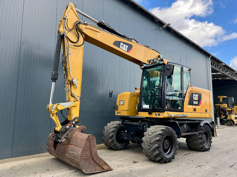 Cat M318F - Багер на тркала: слика 1 Cat M318F - Багер на тркала: слика 1