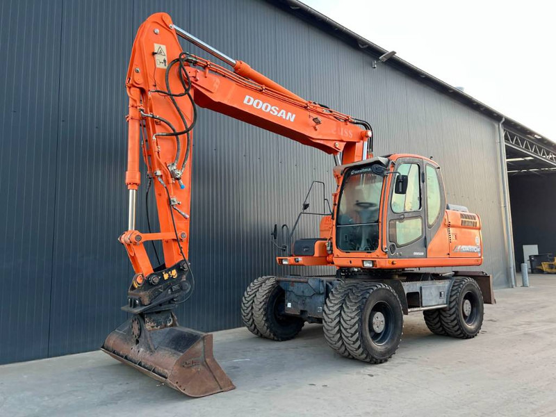 Doosan DX170W - Багер на тркала: слика 1 Doosan DX170W - Багер на тркала: слика 1