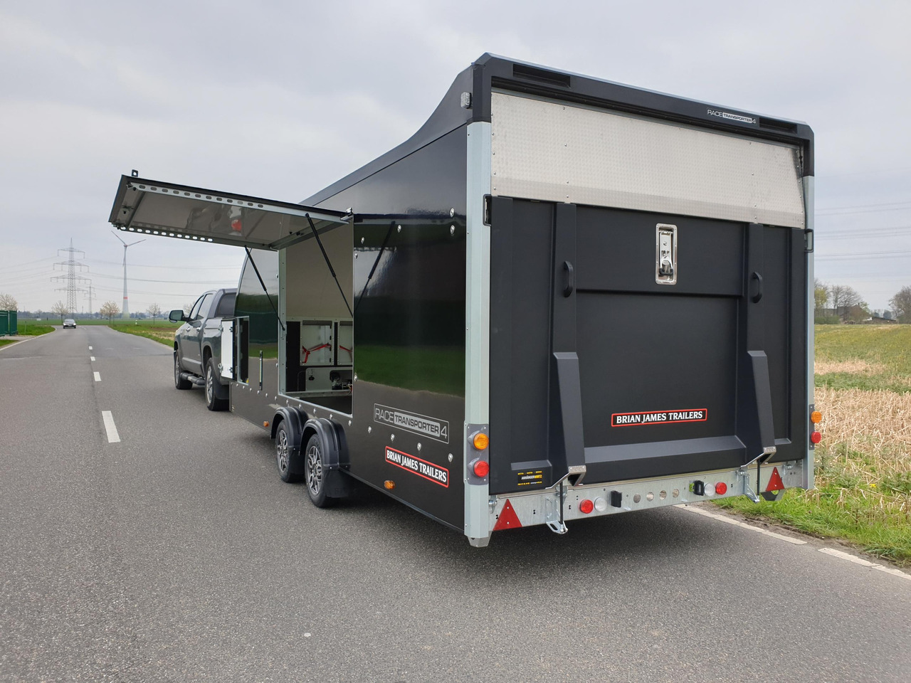 Автотранспортна приколка BJT Race Transporter 4 550x212x188cm blackline E Winde Alufelgen bl FSR ASR RFS 100km/H 3500kg 2024: слика 11