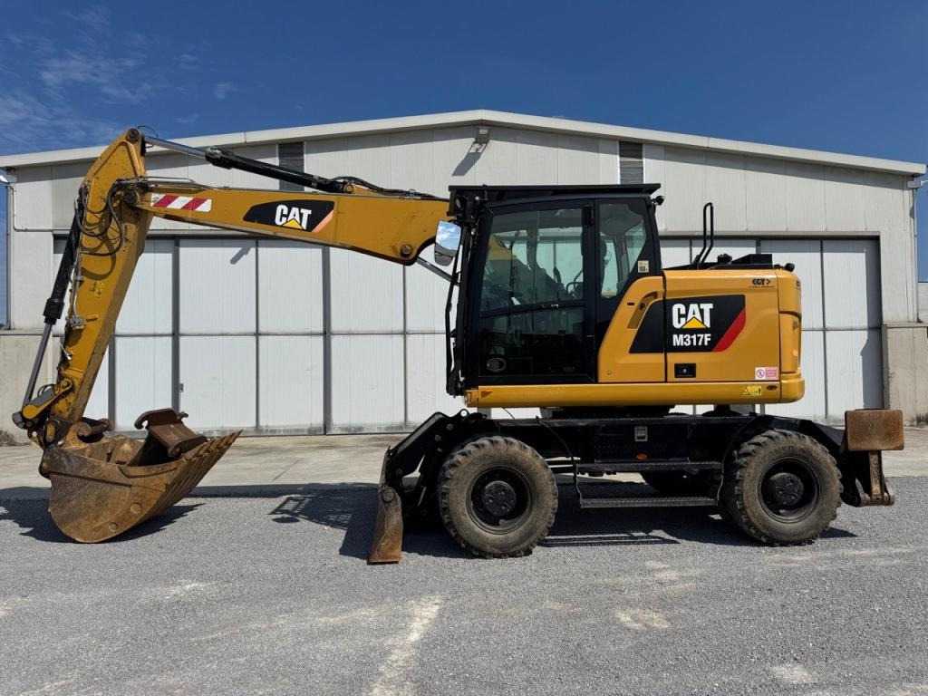 Caterpillar M317F - Багер на тркала: слика 1 Caterpillar M317F - Багер на тркала: слика 1