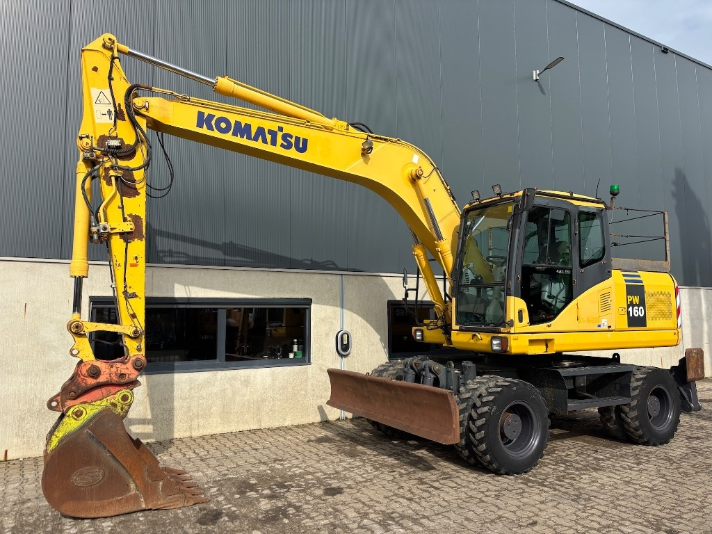 Komatsu PW 160-7 - PW160 - PW 160 - PW 180 - PW 140 - Багер на тркала: слика 1 Komatsu PW 160-7 - PW160 - PW 160 - PW 180 - PW 140 - Багер на тркала: слика 1