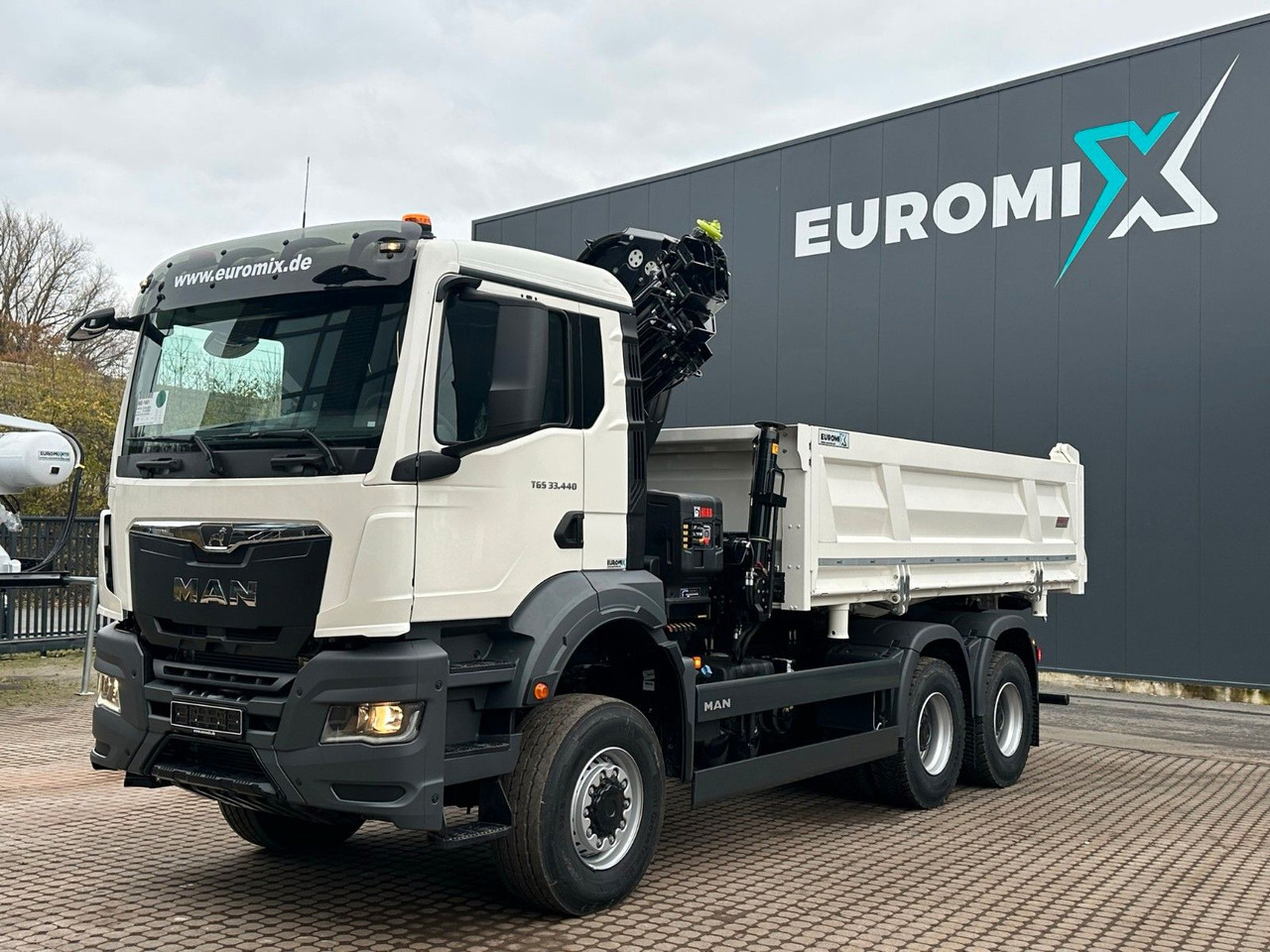 MAN TGS 33.440 6x6 /3-Seiten- Kipper / Kran HIAB 302 - Кипер, Камион со кран: слика 1 MAN TGS 33.440 6x6 /3-Seiten- Kipper / Kran HIAB 302 - Кипер, Камион со кран: слика 1