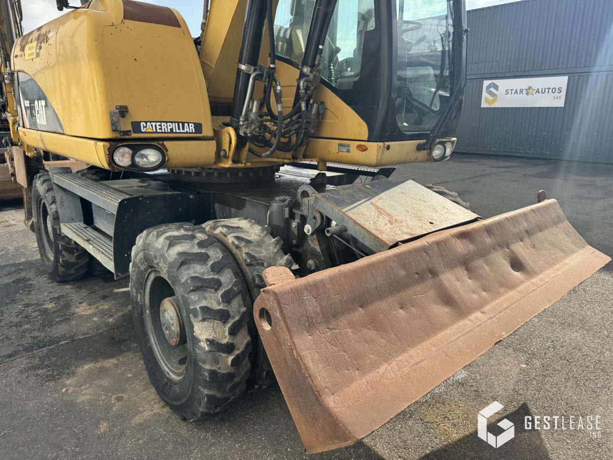 Багер на тркала Caterpillar M313D: слика 7
