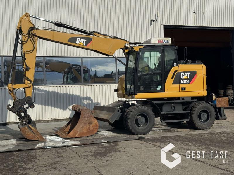 Caterpillar M315F - Багер на тркала: слика 1 Caterpillar M315F - Багер на тркала: слика 1
