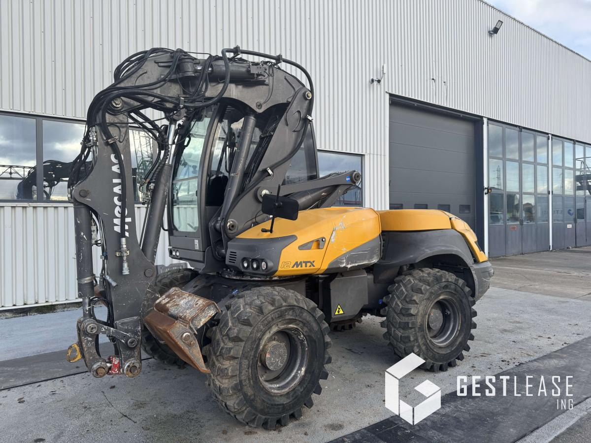 Mecalac 12 MTX - Багер на тркала: слика 1 Mecalac 12 MTX - Багер на тркала: слика 1