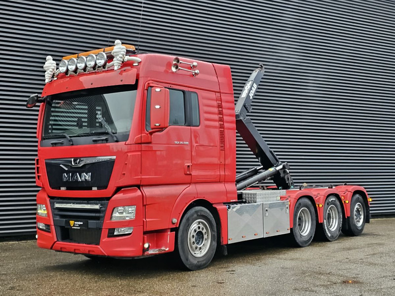 MAN TGX 35.500 / 8x4-4 / ABROLL-KIPPER / HOOKLIFT - Камион со кука за подигање: слика 1 MAN TGX 35.500 / 8x4-4 / ABROLL-KIPPER / HOOKLIFT - Камион со кука за подигање: слика 1