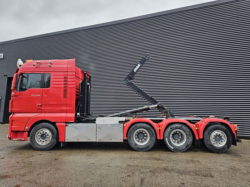 MAN TGX 35.500 / 8x4-4 / ABROLL-KIPPER / HOOKLIFT - Камион со кука за подигање: слика 2 MAN TGX 35.500 / 8x4-4 / ABROLL-KIPPER / HOOKLIFT - Камион со кука за подигање: слика 2