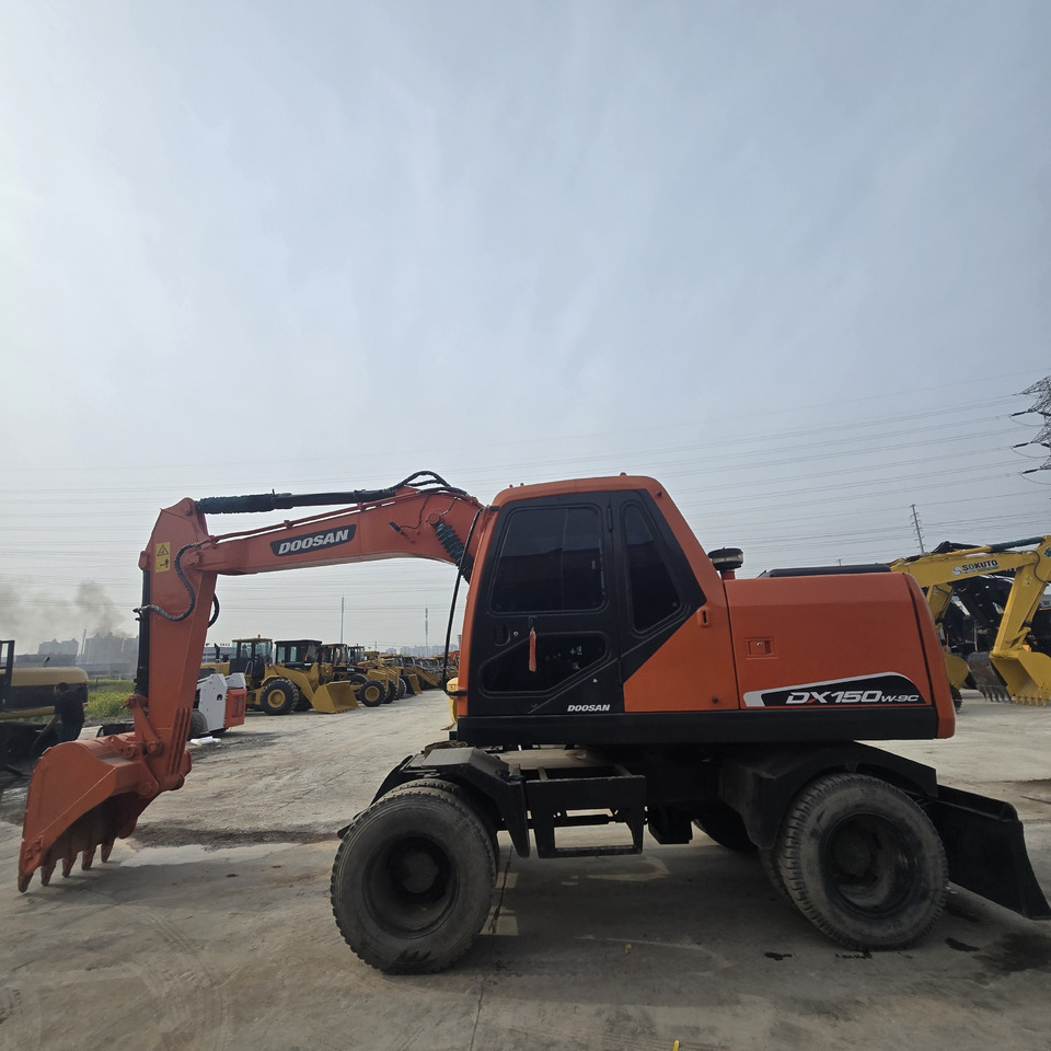 DOOSAN DX150W - Багер на тркала: слика 2 DOOSAN DX150W - Багер на тркала: слика 2