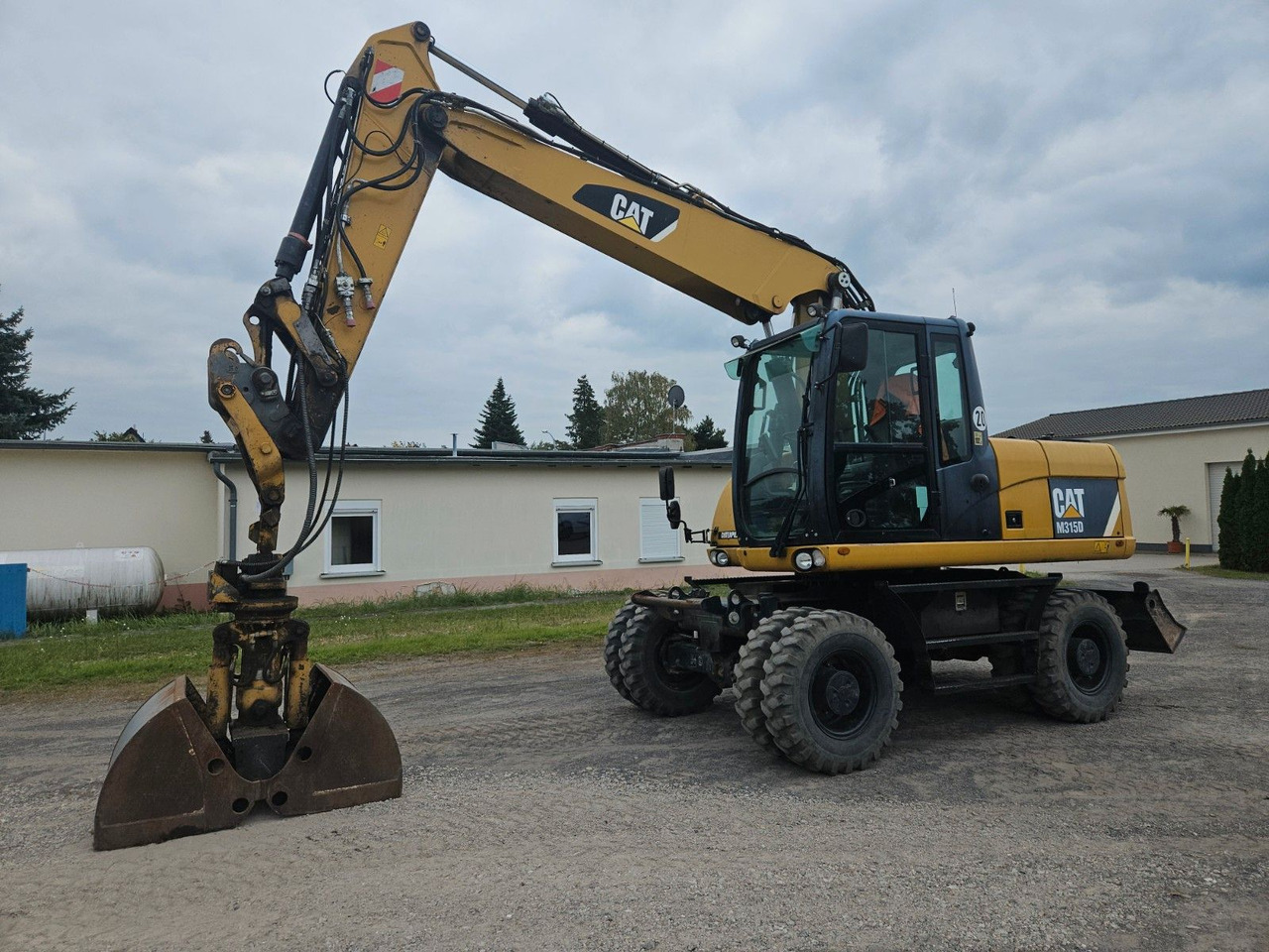 CAT M315D orig. 4.129h - Багер на тркала: слика 1 CAT M315D orig. 4.129h - Багер на тркала: слика 1