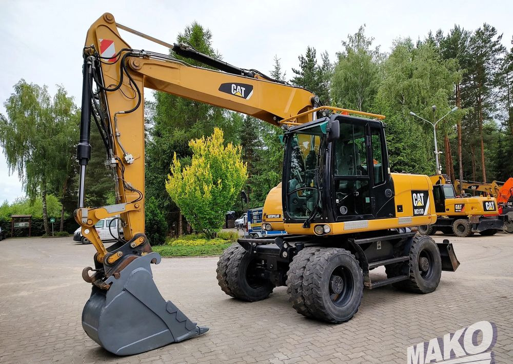 Багер на тркала Caterpillar M313D: слика 7