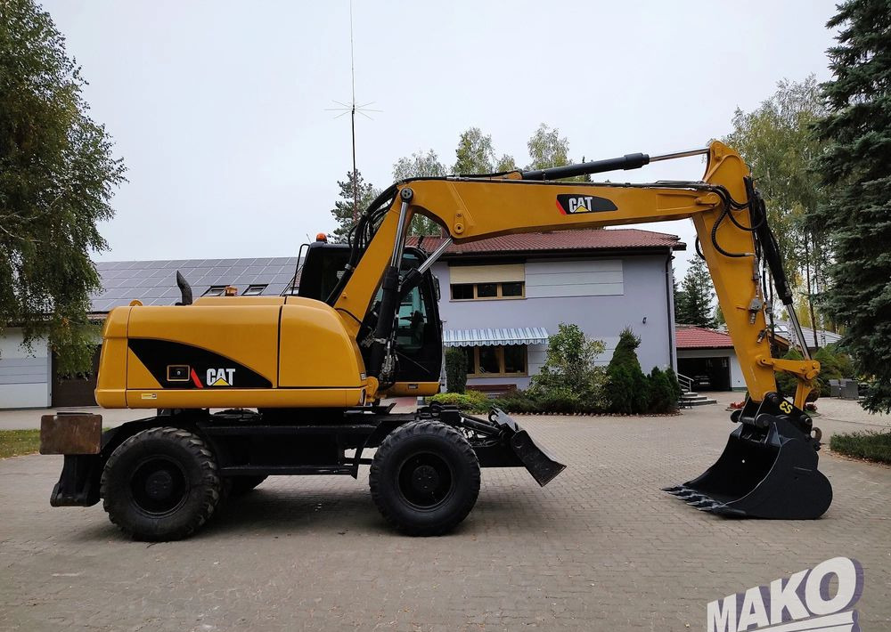 Caterpillar M313D - Багер на тркала: слика 5 Caterpillar M313D - Багер на тркала: слика 5