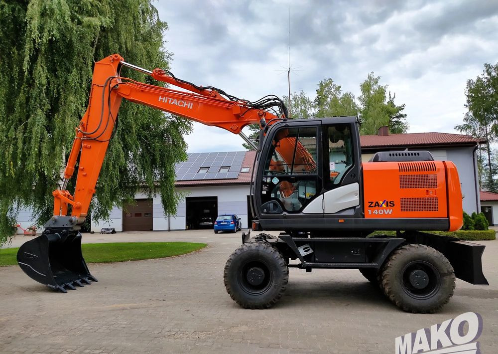 Hitachi ZX 140 - Багер на тркала: слика 1 Hitachi ZX 140 - Багер на тркала: слика 1