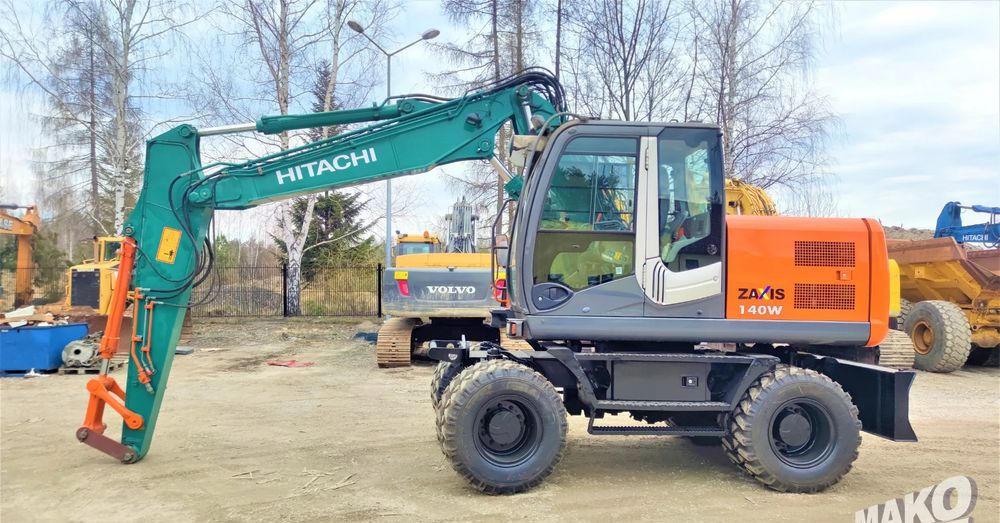Hitachi ZX140W-3 - Багер на тркала: слика 1 Hitachi ZX140W-3 - Багер на тркала: слика 1