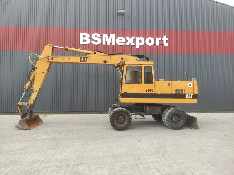 Caterpillar 214 B wheel excavator - Багер на тркала: слика 1 Caterpillar 214 B wheel excavator - Багер на тркала: слика 1