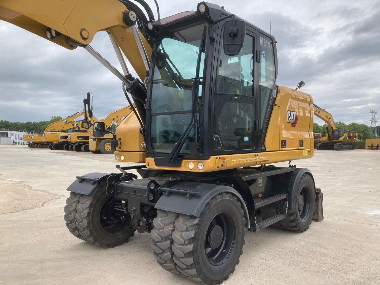 CATERPILLAR M314 - Багер на тркала: слика 2 CATERPILLAR M314 - Багер на тркала: слика 2