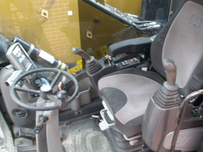 Багер на тркала Caterpillar M318D: слика 7 Багер на тркала Caterpillar M318D: слика 7