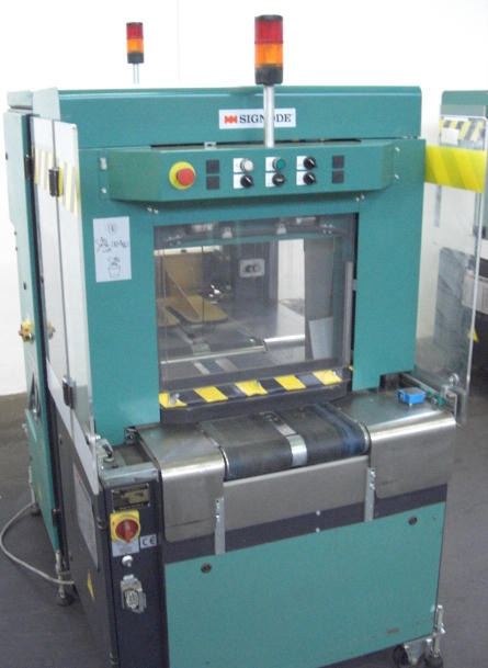 Signode Newsmaster 5500 cross strapping machines - Машина за пакување: слика 1 Signode Newsmaster 5500 cross strapping machines - Машина за пакување: слика 1