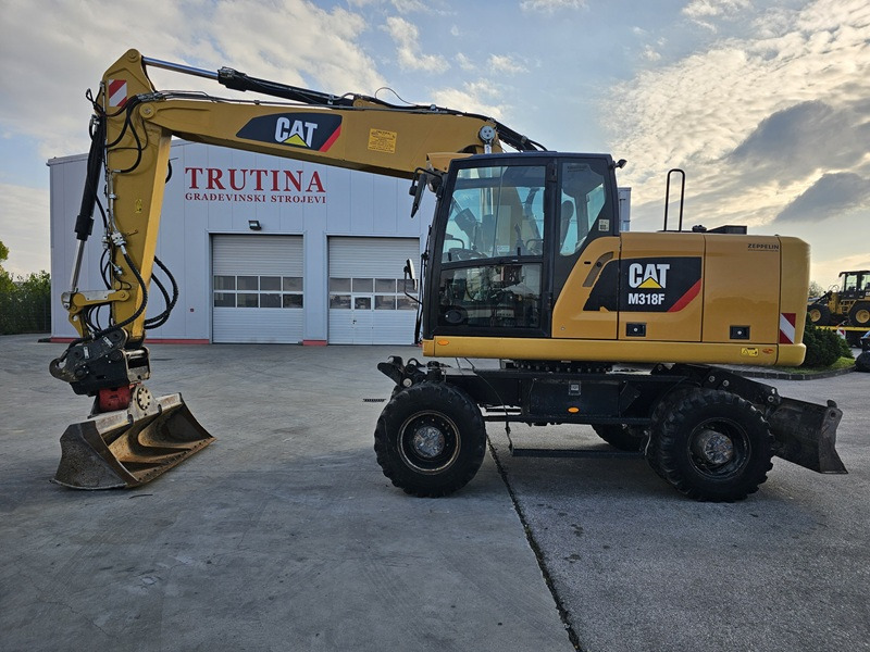 CATERPILLAR M318F - Багер на тркала: слика 1 CATERPILLAR M318F - Багер на тркала: слика 1