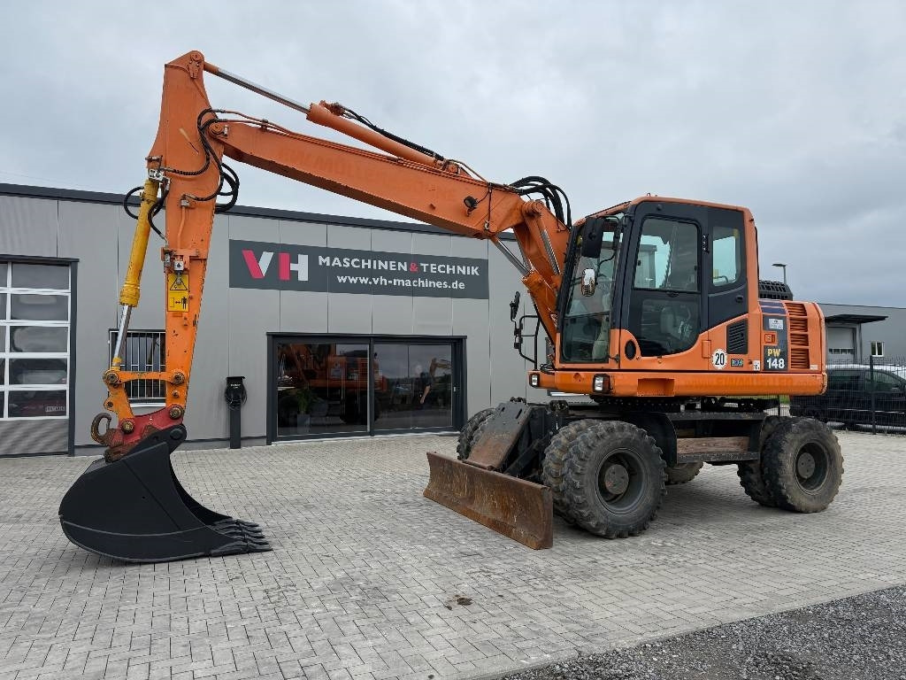 Komatsu PW 148-8 - Багер на тркала: слика 1 Komatsu PW 148-8 - Багер на тркала: слика 1
