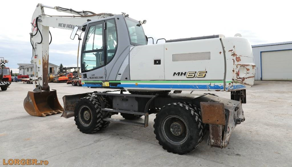 New Holland MH 6.6 + Sandvic Hammer - Багер на тркала: слика 3 New Holland MH 6.6 + Sandvic Hammer - Багер на тркала: слика 3