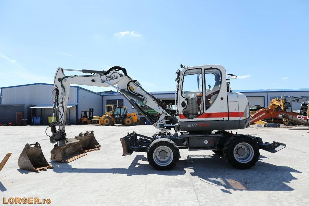 Wacker Neuson EW 100 - Багер на тркала: слика 1 Wacker Neuson EW 100 - Багер на тркала: слика 1