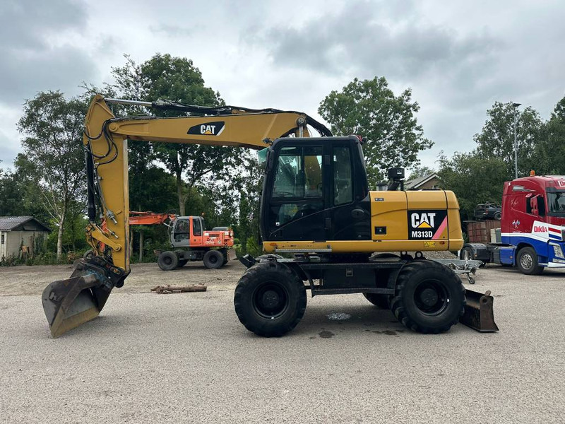 Cat M 313 D - Багер на тркала: слика 1 Cat M 313 D - Багер на тркала: слика 1