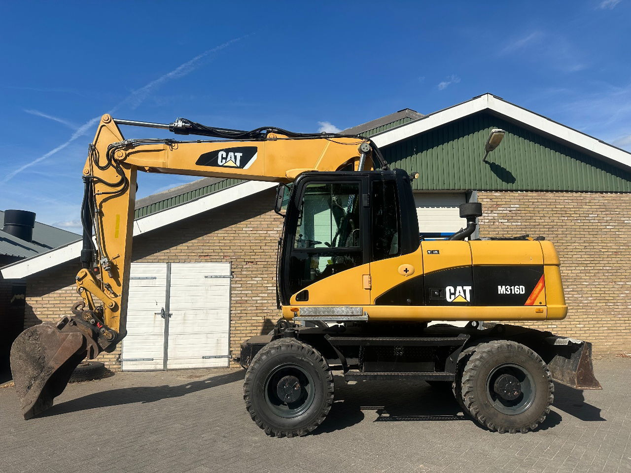 Caterpillar M316D - Натоварувач на тркала: слика 1 Caterpillar M316D - Натоварувач на тркала: слика 1