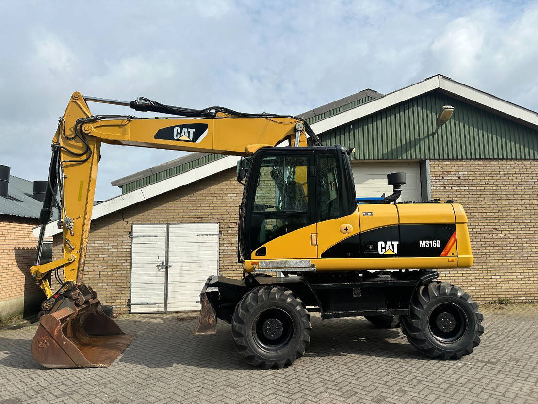 Caterpillar M316D - Багер на тркала: слика 1 Caterpillar M316D - Багер на тркала: слика 1