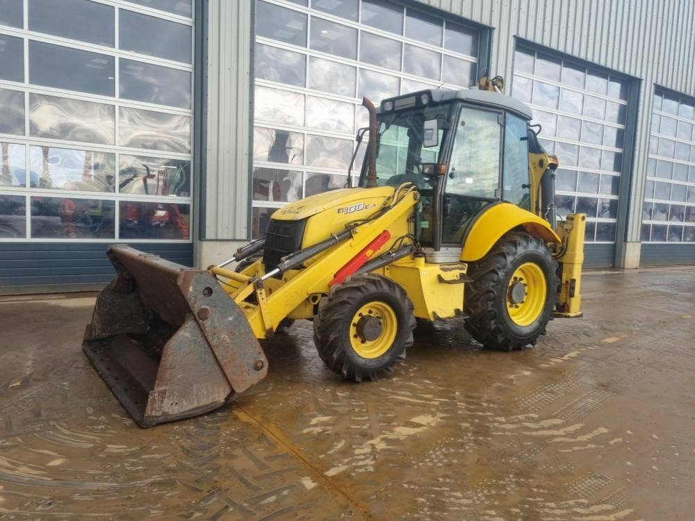 New Holland B 100 C - Ровокопач: слика 1 New Holland B 100 C - Ровокопач: слика 1