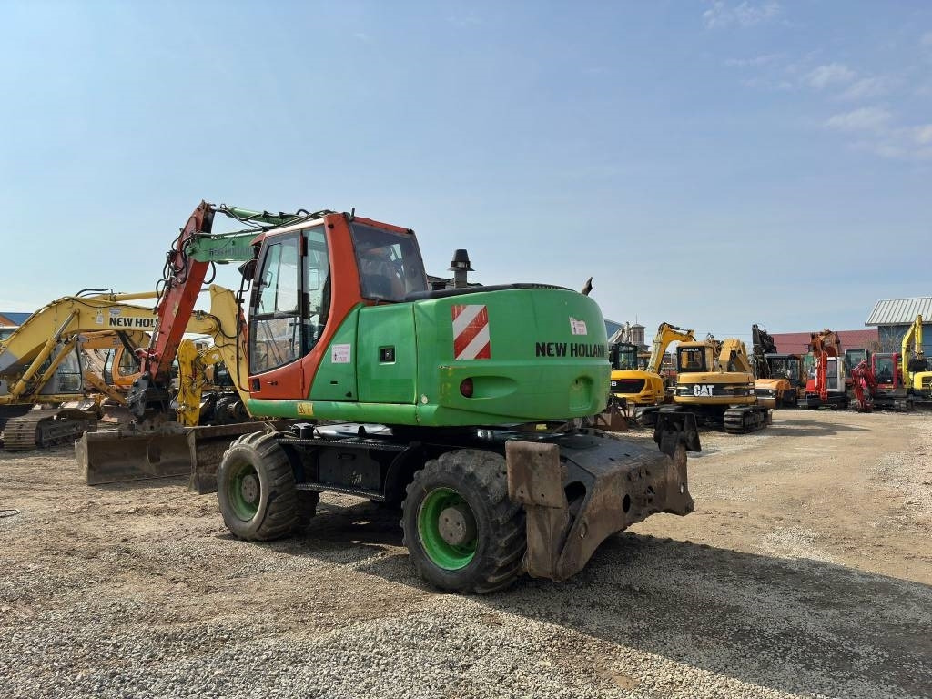 New Holland MH Plus - Багер на тркала: слика 5 New Holland MH Plus - Багер на тркала: слика 5