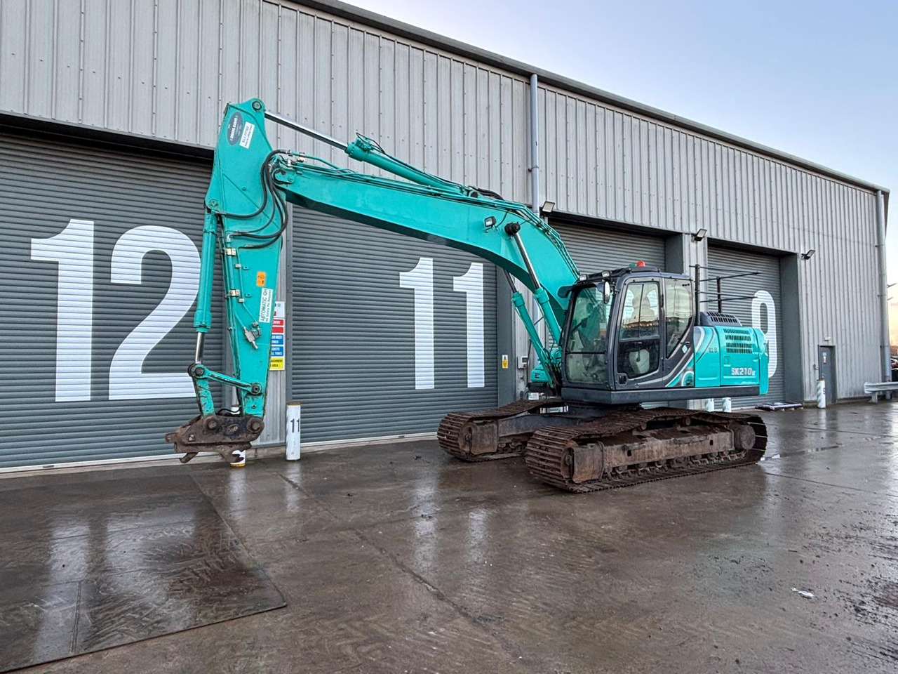 Kobelco SK210LC-10 - Багер гасеничар: слика 1 Kobelco SK210LC-10 - Багер гасеничар: слика 1