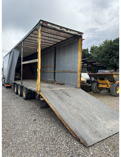 Schmitz Cargobull Machine transport trailer with bag ramp - Полуприколка: слика 1 Schmitz Cargobull Machine transport trailer with bag ramp - Полуприколка: слика 1