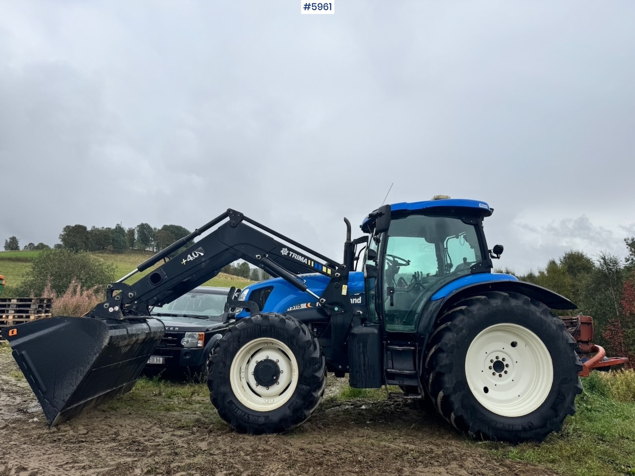 2004 New Holland TS115A with front loader - Трактор: слика 1 2004 New Holland TS115A with front loader - Трактор: слика 1