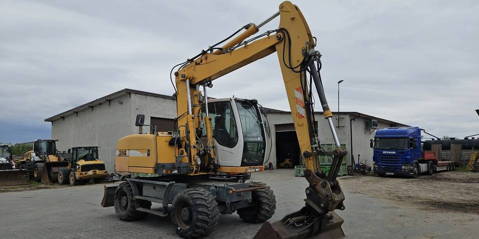 Koparka kołowa Liebherr A314 Litronic 9350 h 4 łyżki kołówka - Багер на тркала: слика 4 Koparka kołowa Liebherr A314 Litronic 9350 h 4 łyżki kołówka - Багер на тркала: слика 4