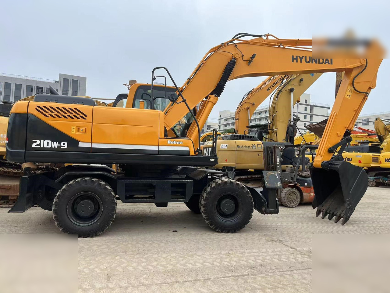 HYUNDAI ROBEX 210W-9 - Багер на тркала: слика 1 HYUNDAI ROBEX 210W-9 - Багер на тркала: слика 1
