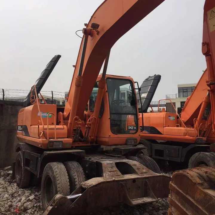 Used Digger Doosan Dh210w-7 Construction Machinery Construction Digger Used Doosan Dh210w-7 Cheap Excavator - Багер на тркала: слика 1 Used Digger Doosan Dh210w-7 Construction Machinery Construction Digger Used Doosan Dh210w-7 Cheap Excavator - Багер на тркала: слика 1