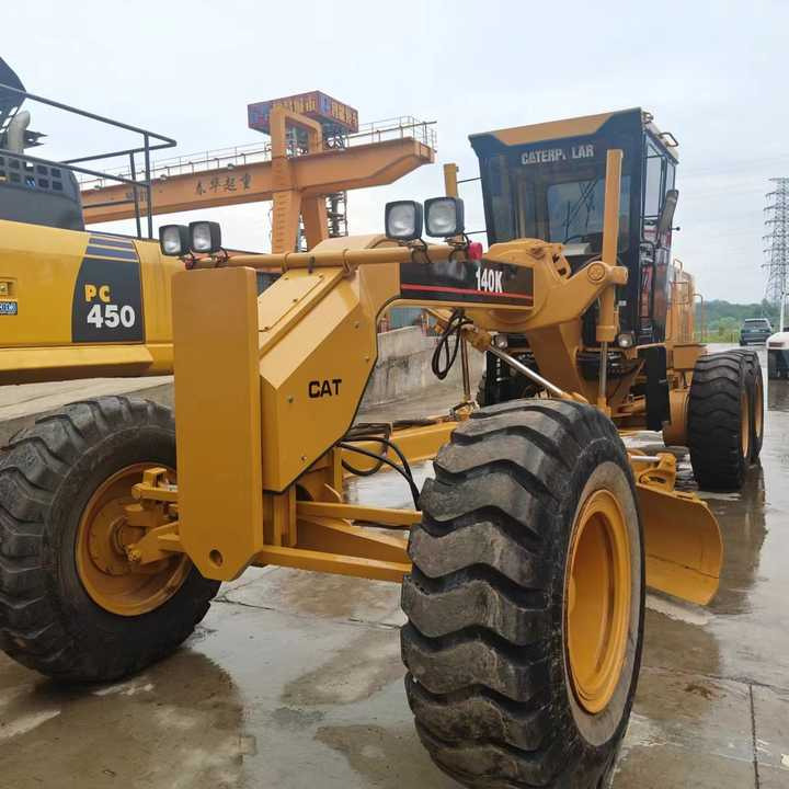 Used Cat 140K New Model Grader Popular Brand Japan Cat Hydraulic Machinery Construction Equipment - Порамнувач: слика 1 Used Cat 140K New Model Grader Popular Brand Japan Cat Hydraulic Machinery Construction Equipment - Порамнувач: слика 1