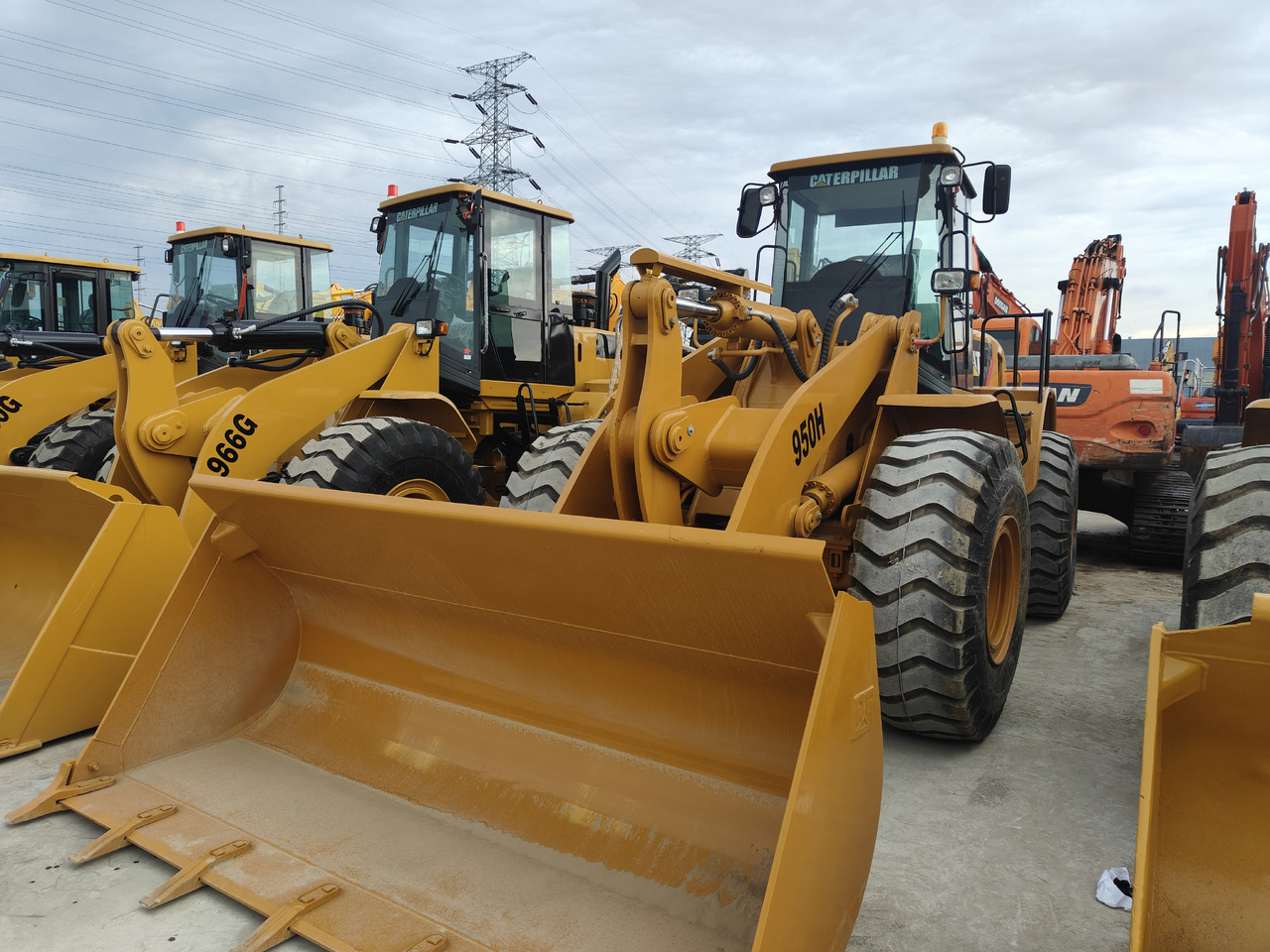 CATERPILLAR 950H - Натоварувач на тркала: слика 1 CATERPILLAR 950H - Натоварувач на тркала: слика 1