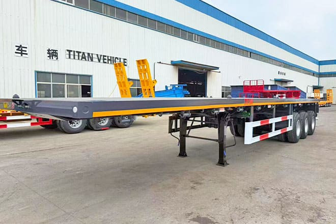TITAN 3 Axle Flatbed Semi Trailer for Sale in Ghana - Полуприколка платформа: слика 1 TITAN 3 Axle Flatbed Semi Trailer for Sale in Ghana - Полуприколка платформа: слика 1