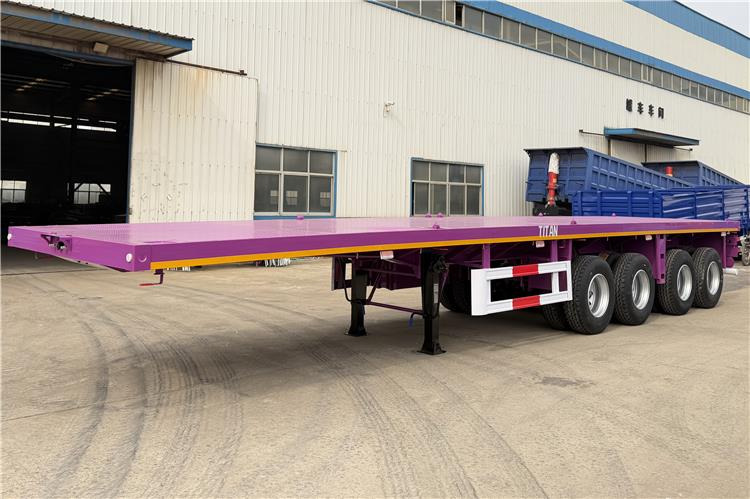 TITAN 4 Axle 40ft Flatbed Semi Trailer for Sale In Guam - Полуприколка платформа: слика 1 TITAN 4 Axle 40ft Flatbed Semi Trailer for Sale In Guam - Полуприколка платформа: слика 1