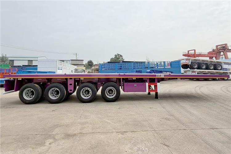TITAN 4 Axle 40ft Flatbed Semi Trailer for Sale In Guam - Полуприколка платформа: слика 2 TITAN 4 Axle 40ft Flatbed Semi Trailer for Sale In Guam - Полуприколка платформа: слика 2